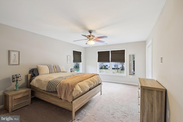 bedroom featuring ceiling fan and light colored carpet