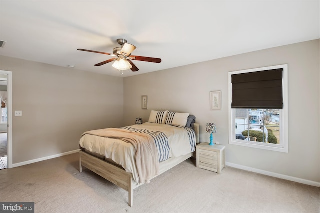 bedroom featuring ceiling fan and light colored carpet