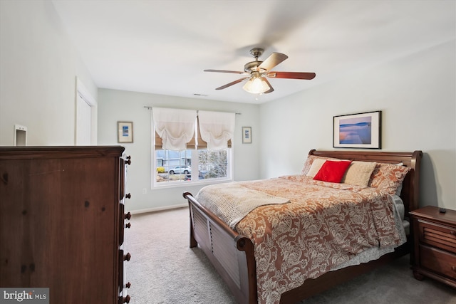 bedroom with light carpet and ceiling fan