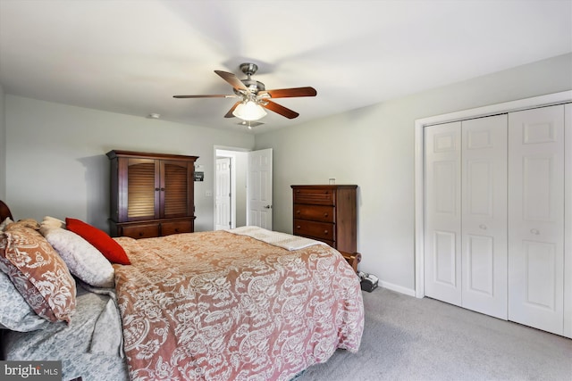 bedroom with carpet floors, a closet, and ceiling fan