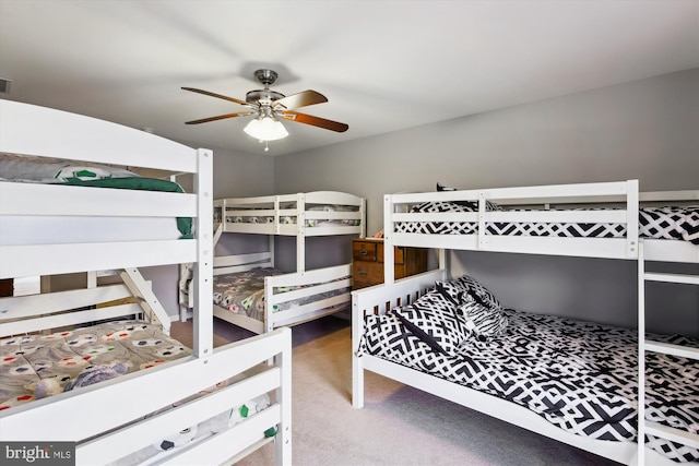 bedroom with ceiling fan and carpet floors