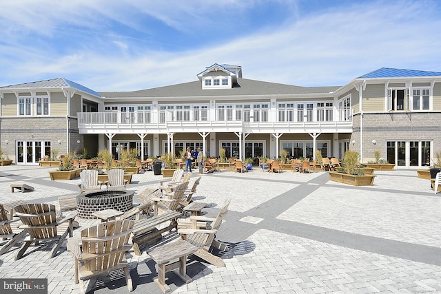 back of house featuring a patio area and french doors