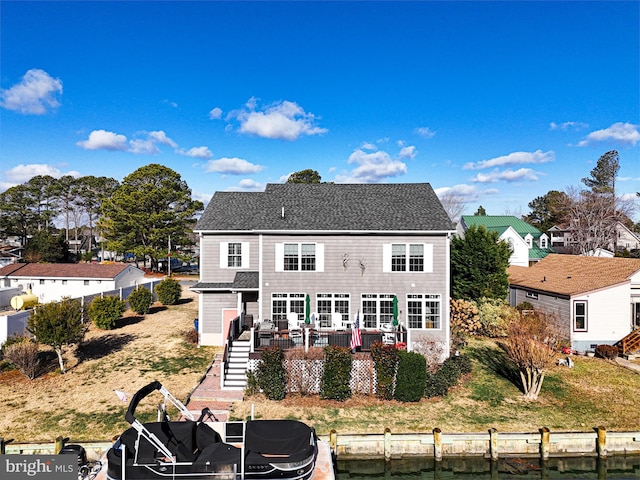 rear view of house featuring a wooden deck