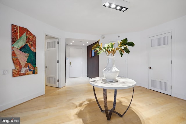 hallway featuring light hardwood / wood-style flooring