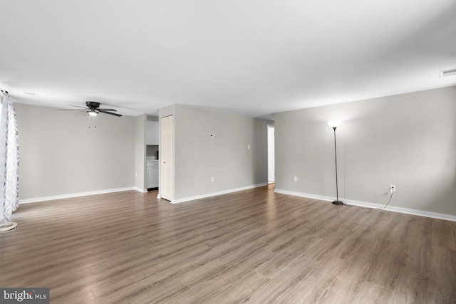 empty room featuring hardwood / wood-style flooring and ceiling fan