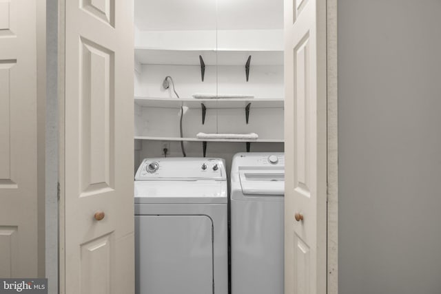 washroom featuring washing machine and dryer