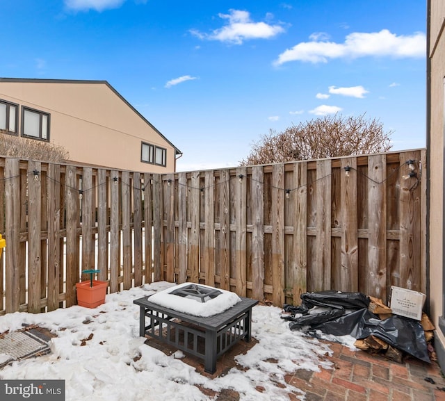 view of snow covered patio