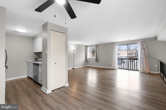 kitchen featuring sink, dishwasher, dark hardwood / wood-style floors, and white cabinets