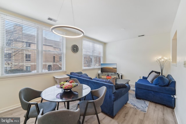 living room with light hardwood / wood-style flooring