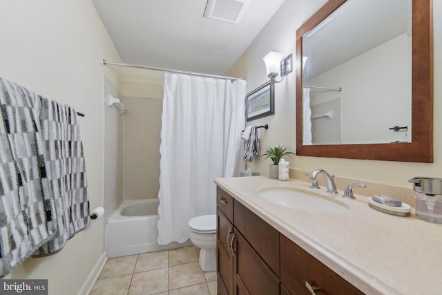 full bathroom with vanity, toilet, shower / bath combo with shower curtain, and tile patterned flooring