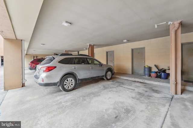 garage featuring a carport