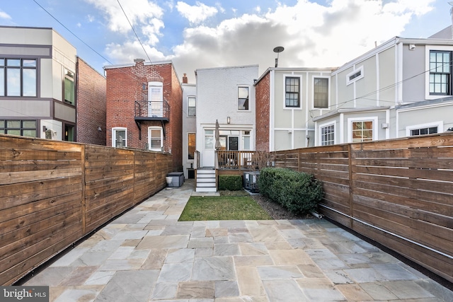 back of property featuring a patio area