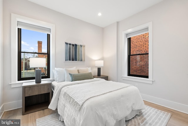 bedroom with light hardwood / wood-style flooring