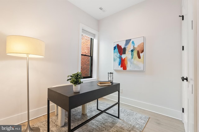 home office featuring hardwood / wood-style flooring