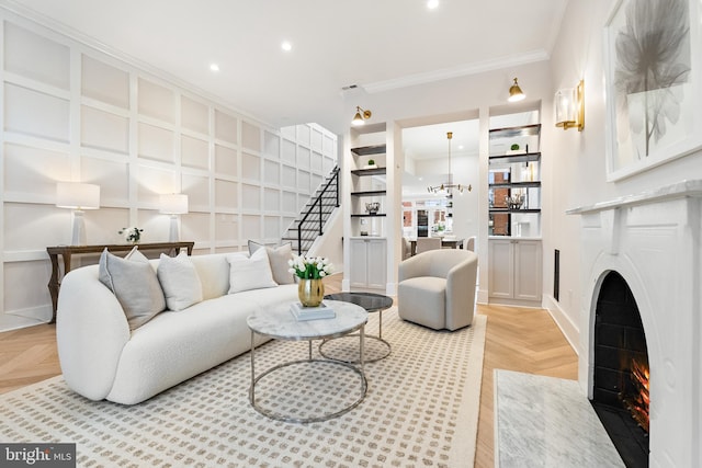 living room featuring crown molding and light parquet flooring