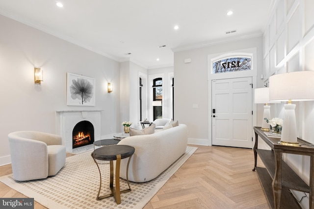 living room with crown molding and light parquet floors