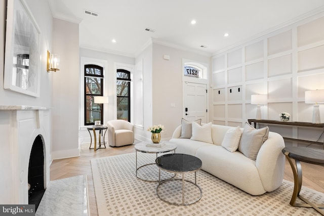 living room featuring ornamental molding and light parquet floors