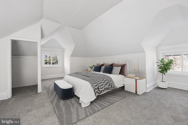 carpeted bedroom with vaulted ceiling