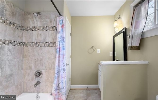 bathroom with vanity and shower / bath combo with shower curtain