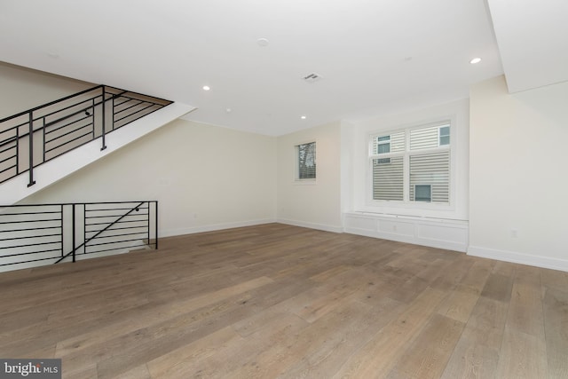 unfurnished living room featuring light hardwood / wood-style floors