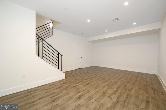 unfurnished living room with hardwood / wood-style floors