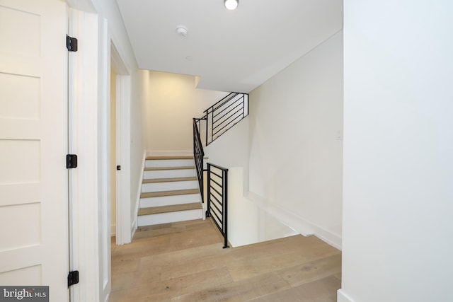 staircase featuring hardwood / wood-style floors