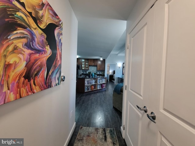 hall with dark hardwood / wood-style floors