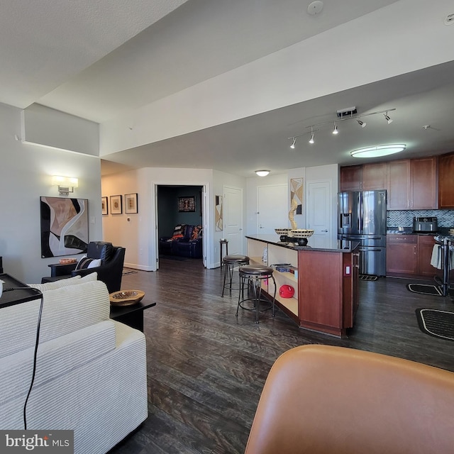 living room with dark hardwood / wood-style floors