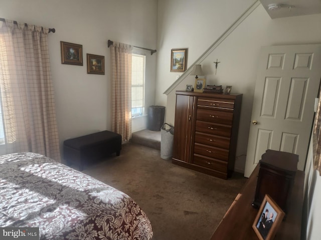 bedroom featuring dark colored carpet