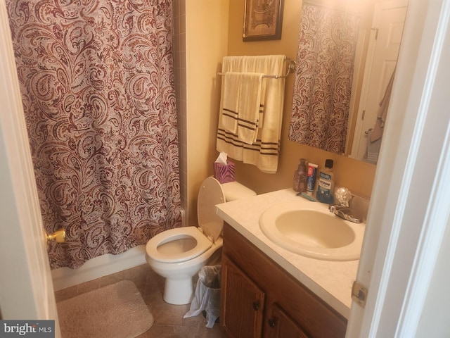 full bathroom with vanity, shower / tub combo with curtain, tile patterned floors, and toilet