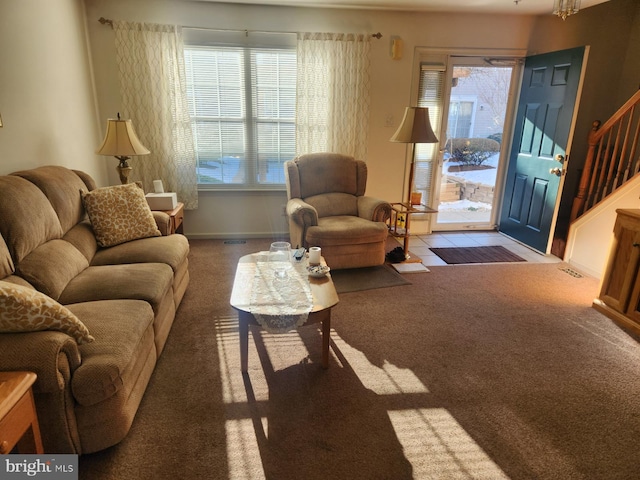 carpeted living room with plenty of natural light