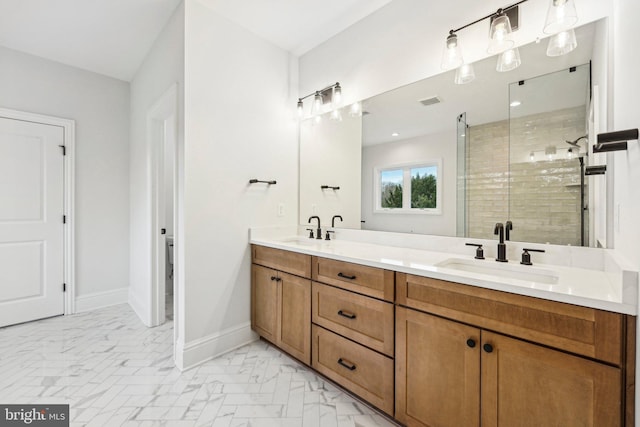 bathroom with a shower with door and vanity