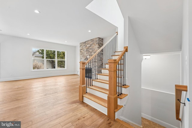 stairs with wood-type flooring