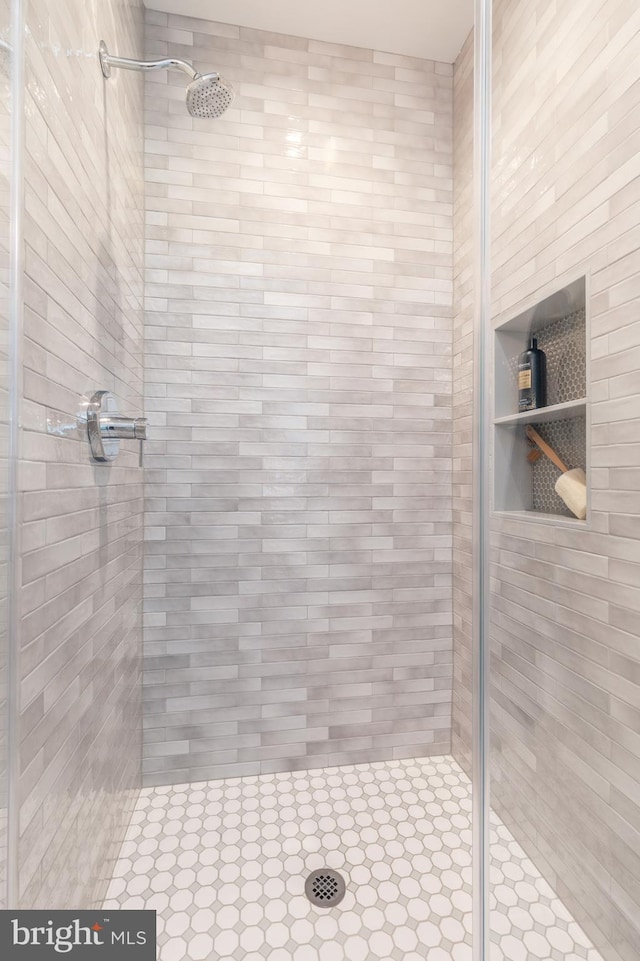 bathroom featuring an enclosed shower