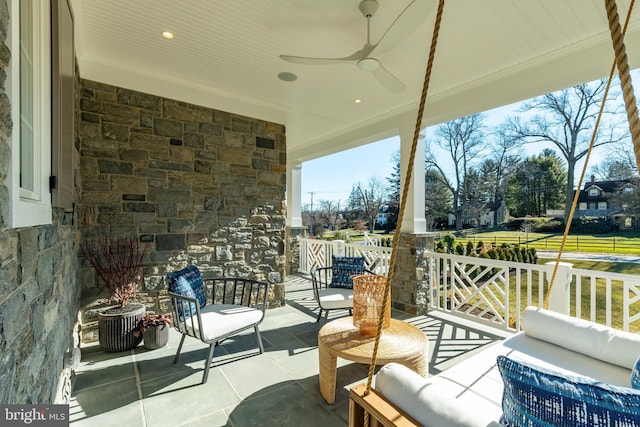 view of patio featuring an outdoor hangout area and ceiling fan