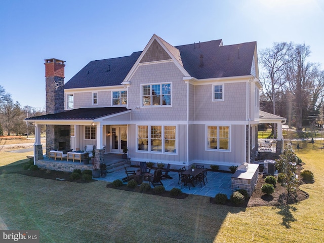 rear view of property featuring a patio, central AC unit, and a lawn