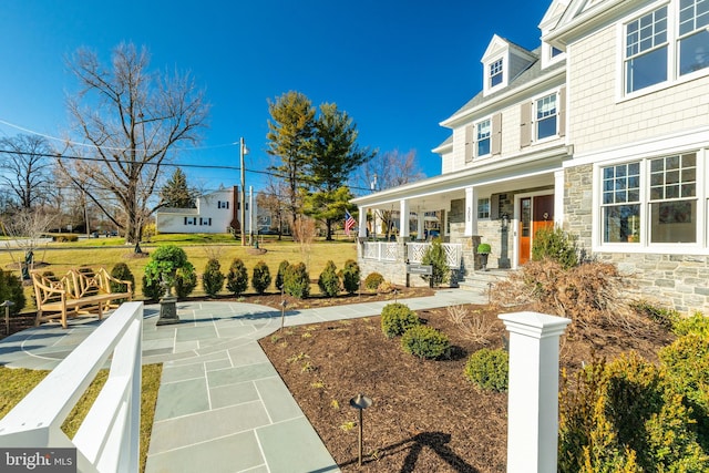 view of property's community with a lawn