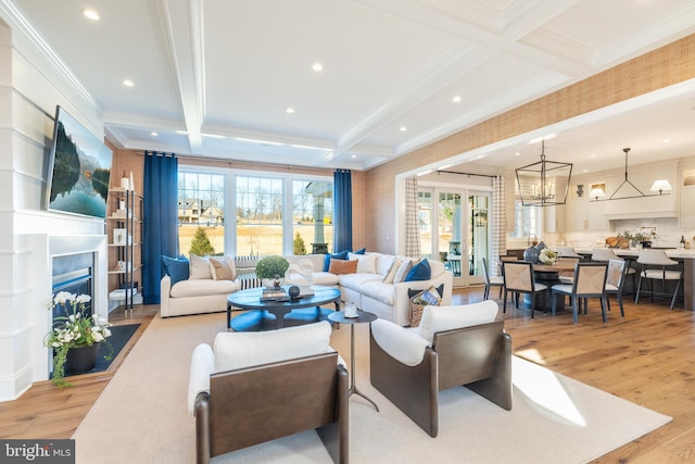 living room with beamed ceiling, coffered ceiling, and light wood-type flooring