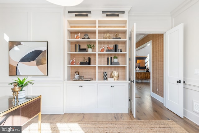 room details featuring hardwood / wood-style flooring and ornamental molding