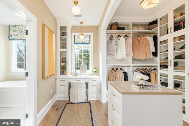 mudroom with light hardwood / wood-style flooring