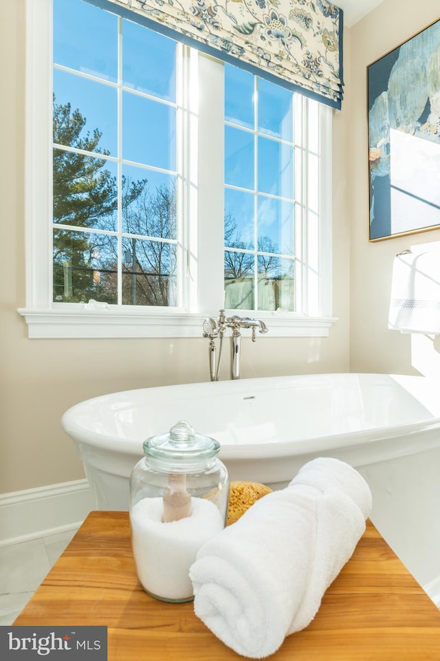 room details featuring a tub to relax in