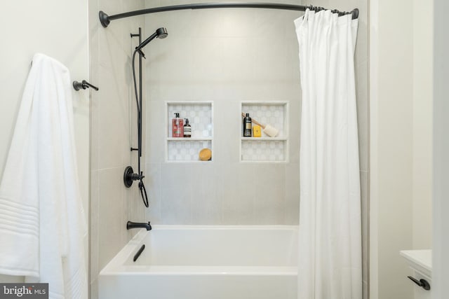 bathroom with shower / bath combination with curtain