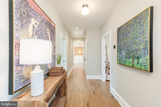 corridor featuring light hardwood / wood-style floors