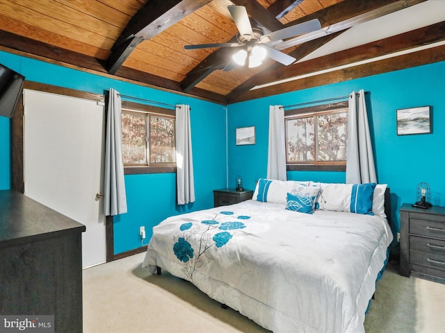 bedroom featuring vaulted ceiling with beams, ceiling fan, and wooden ceiling