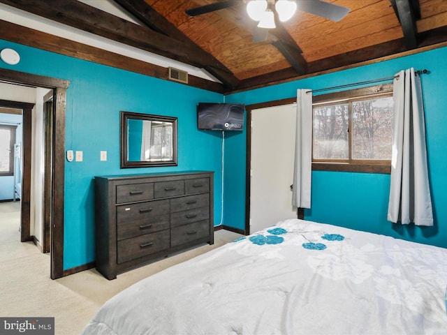 carpeted bedroom with vaulted ceiling with beams, ceiling fan, and wood ceiling