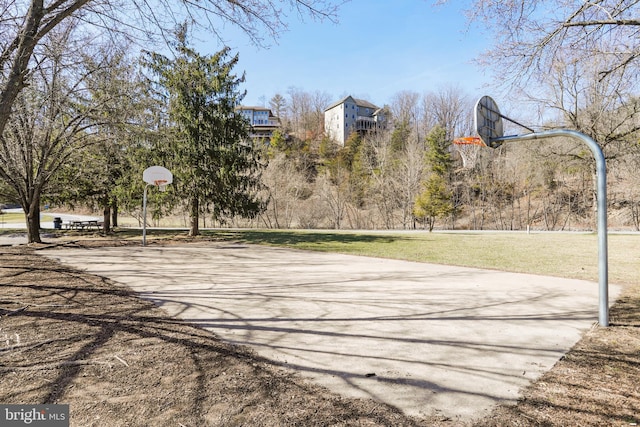 view of basketball court featuring a yard