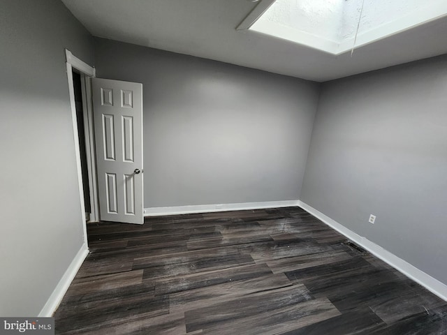 empty room featuring dark hardwood / wood-style floors