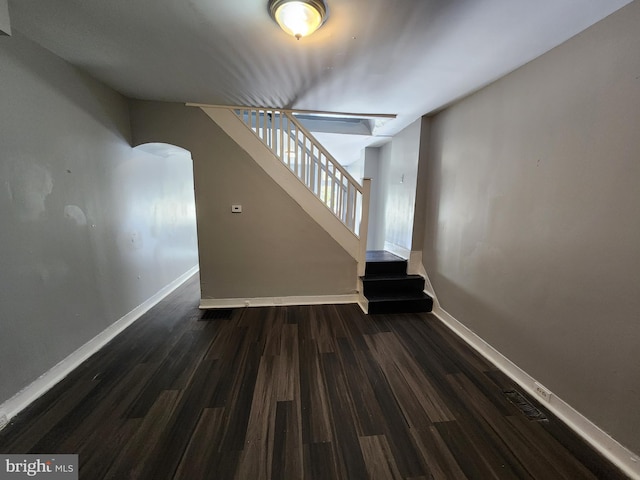 stairs with wood-type flooring