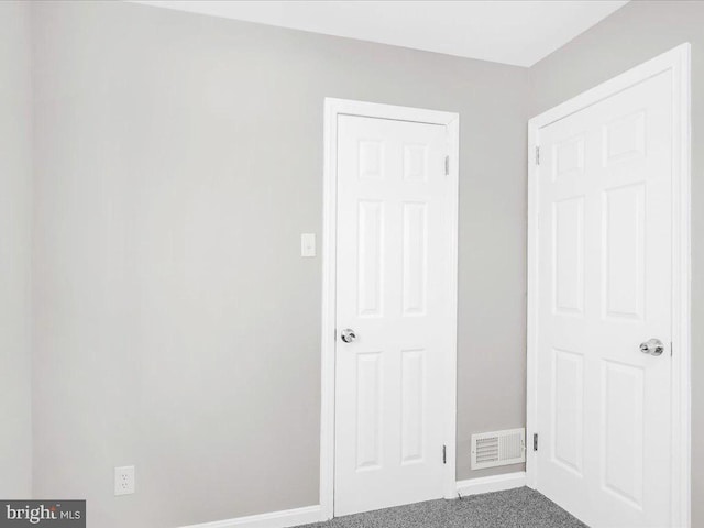 unfurnished bedroom with carpet