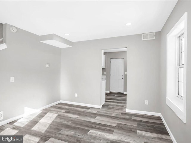 empty room featuring dark wood-type flooring